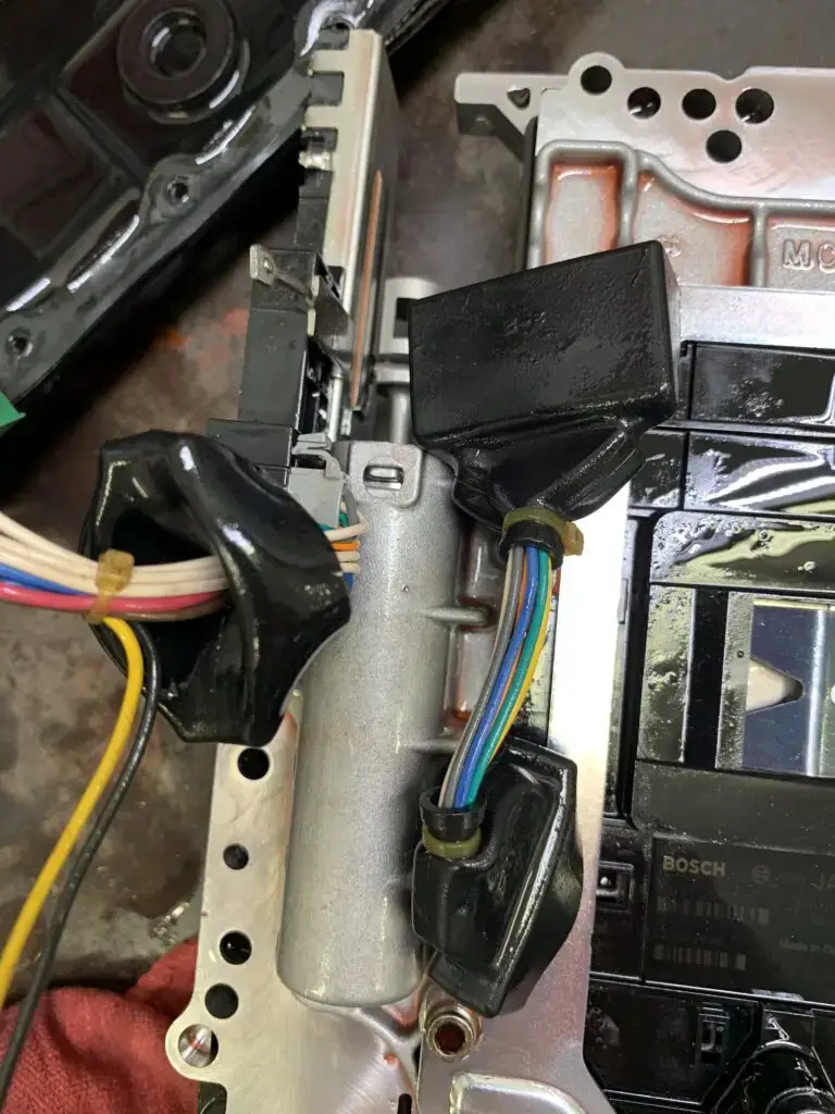 damaged harness and connector often cause the p1701 code